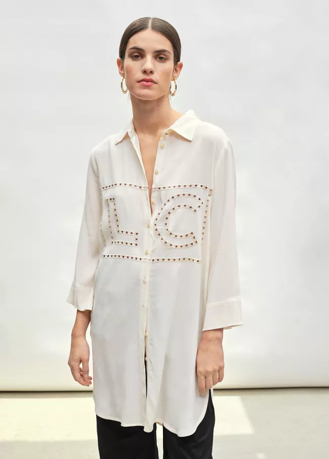 Blouse with embroidered die-cut logo