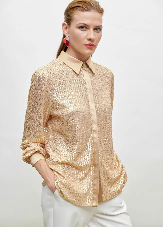 Camisa de lantejoulas douradas