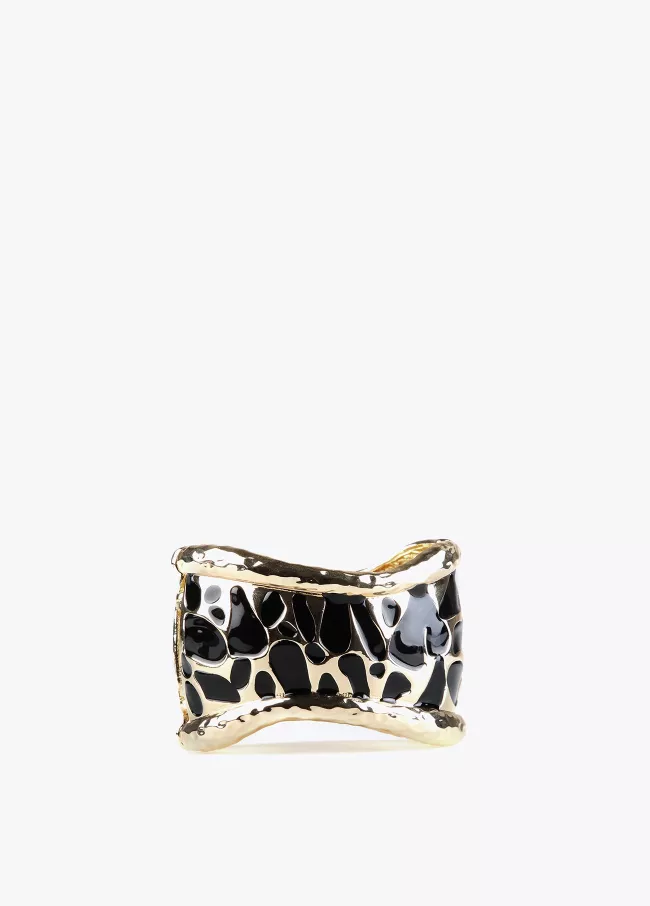Brazalete iregular motivo animal y  metal...