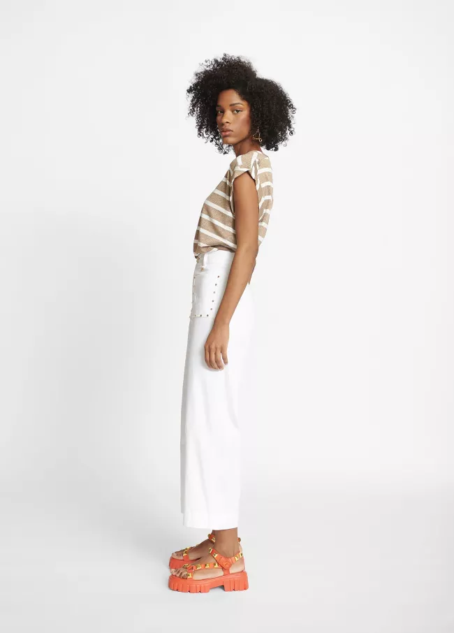 Trousers with gold stud details