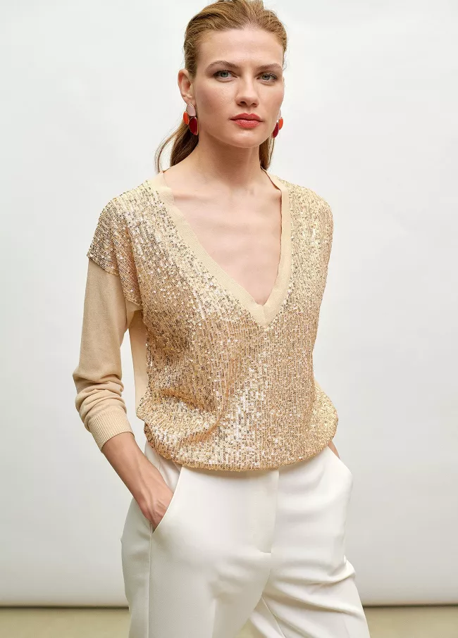 Camisola bico de lantejoulas douradas